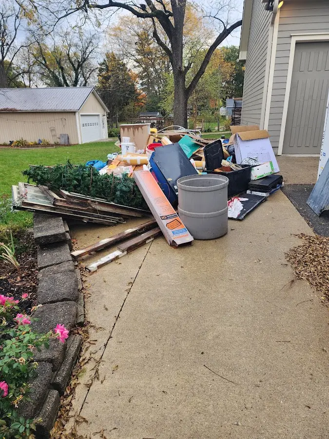 Dumpster being loaded with debris for 30 Yard Dumpster Rental in Monona